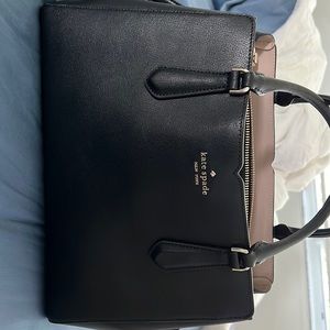 Black Kate Spade purse can be used as shoulder bag or carry like satchel.